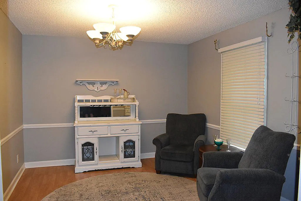 4509 Doncaster Dr - Dining Room with Chair Rail, Wood Floors as Seen from Living Room