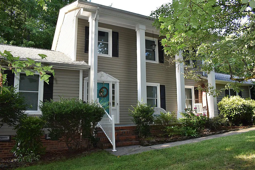 4509 Doncaster Dr - Front of House as Seen from Front Yard with Large Front Porch and Lush Landscaping